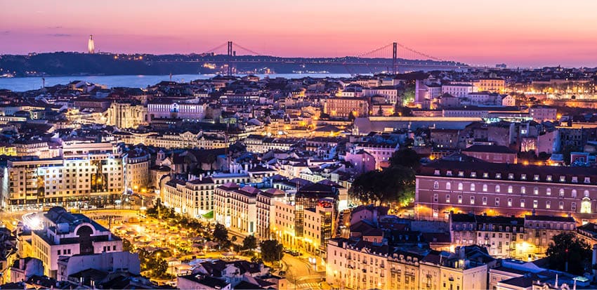 Aerial view through the illuminated city of Lisbon  Evening in the Portuguese capital