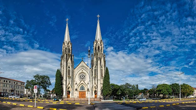 BOTUCATU, SAO PAULO, BRAZIL - JANUARY 02, 2019: OCathedral church of Botucatu, panoramic photo of the cathedral under blue sky with clouds at dawn