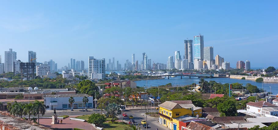A view on historic and modern Cartagena de Indies of Colombia from San Filipe de Barajas Castle. City panorama and waters of Caribbean Sea on a beautiful morning.