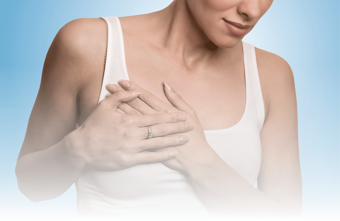 Closeup cropped portrait young woman with breast pain touching chest colored isolated on blue background 